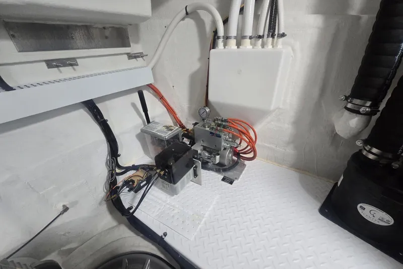 Slide: The Image of Engine room of 2018 Cruisers Yachts 50 Cantius, showcasing mechanical components and wiring. - 42