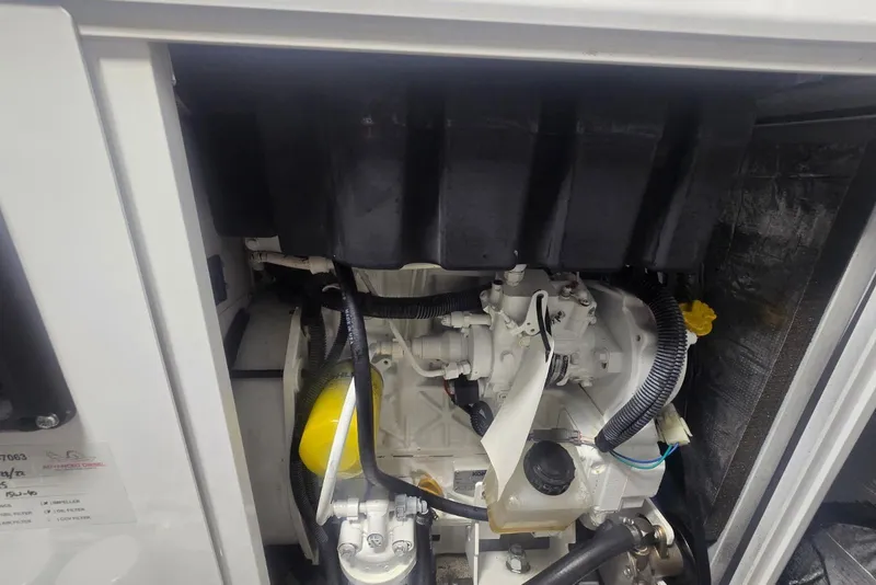 Slide: The Image of Engine compartment of 2018 Cruisers Yachts 50 Cantius, showcasing mechanical components. - 51