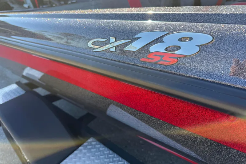 Slide: The Image of 2022 Caymas CX 18 SS boat with metallic finish and red accents. - 1