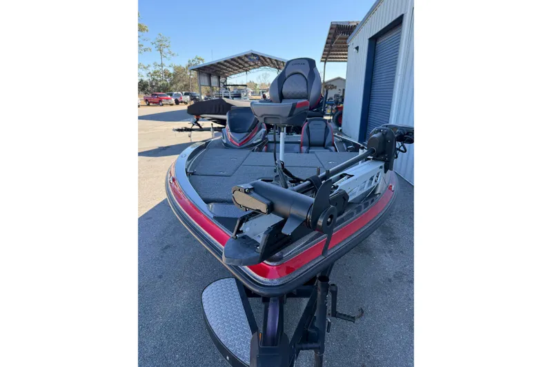 Slide: The Image of 2022 Caymas CX 18 SS bass boat with trolling motor, parked outdoors. - 10