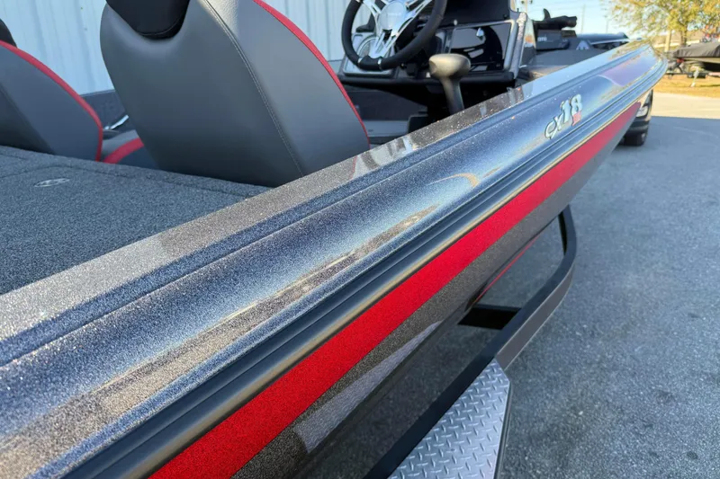 Slide: The Image of 2022 Caymas CX 18 SS boat with sleek design and red accents. - 4