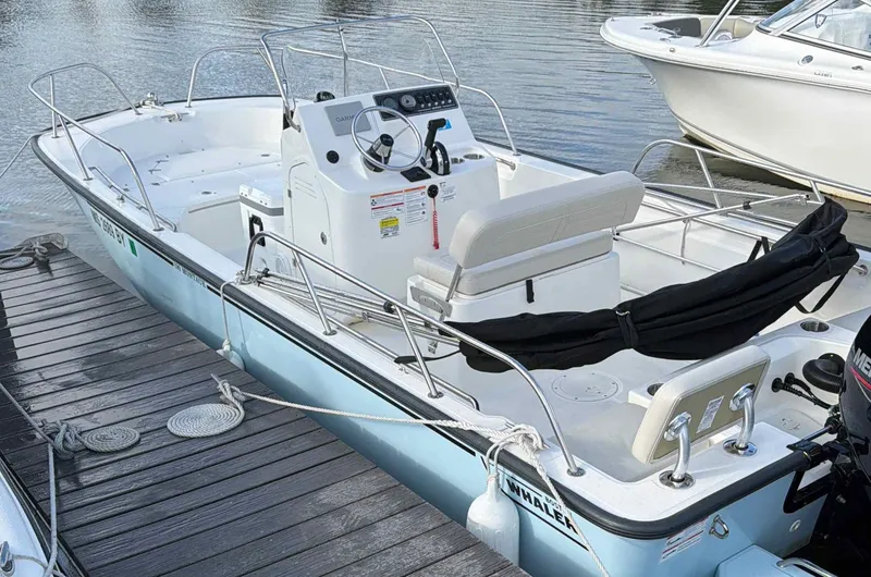 Slide: The Image of Boston Whaler 190 Montauk 2025 at dock, interior view. - 3