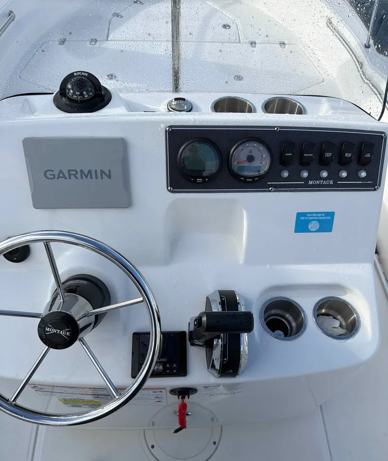 Slide: The Image of Boston Whaler 190 Montauk 2025 helm with Garmin system. - 4