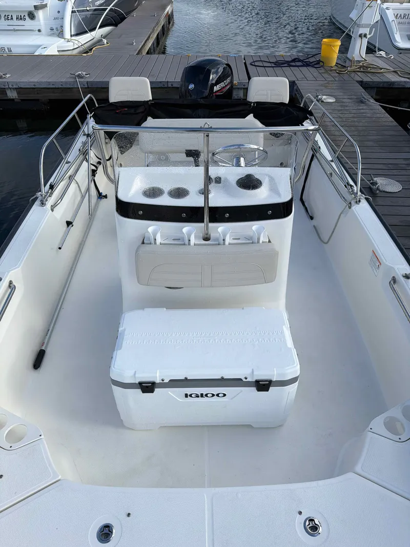 Slide: The Image of Interior view of a 2025 Boston Whaler 190 Montauk boat at dock. - 7