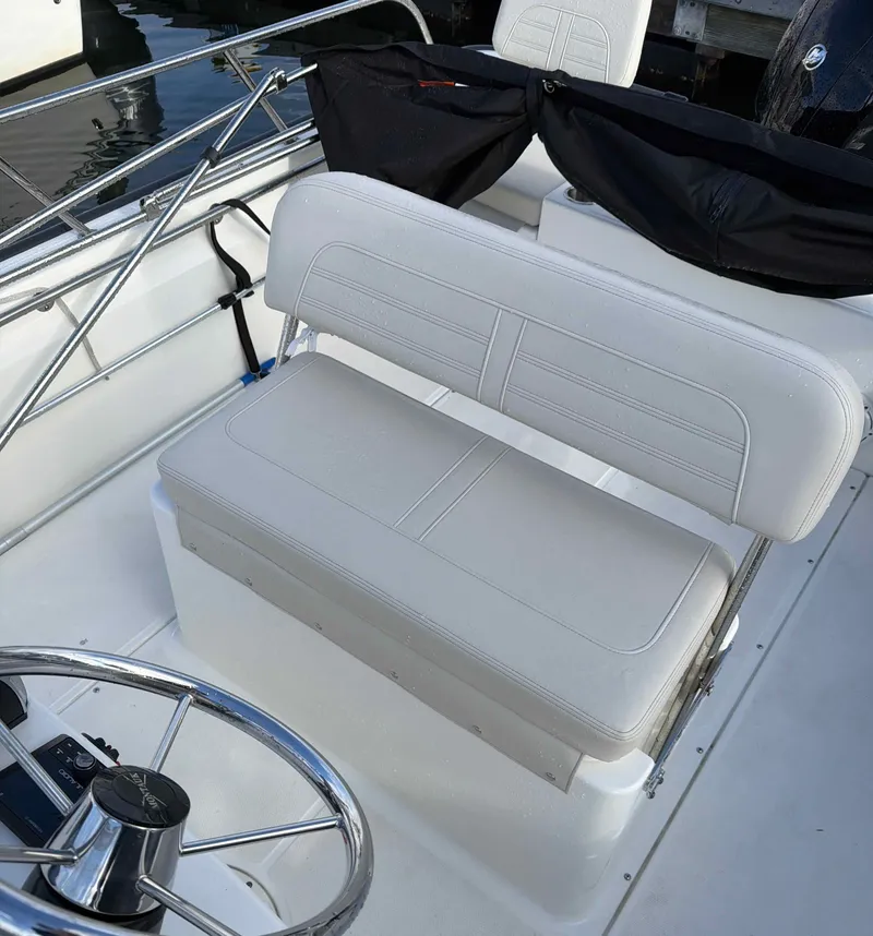 Slide: The Image of Interior of 2025 Boston Whaler 190 Montauk with white seating. - 8