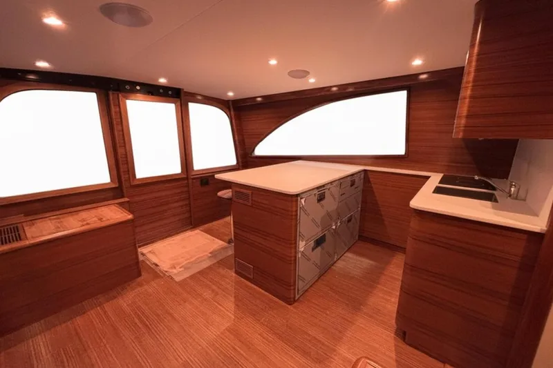 Slide: The Image of Luxurious interior of 2026 Weaver Sportfish yacht with wood finish and modern amenities. - 3