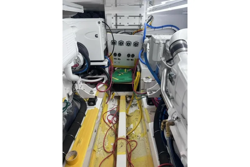 Slide: The Image of Engine room of a 2026 Weaver Sportfish boat, showcasing complex wiring and machinery. - 4