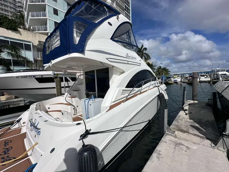 Slide: The Image of 2007 Sea Ray 36 Sedan Bridge at dock, sunny day. - 2