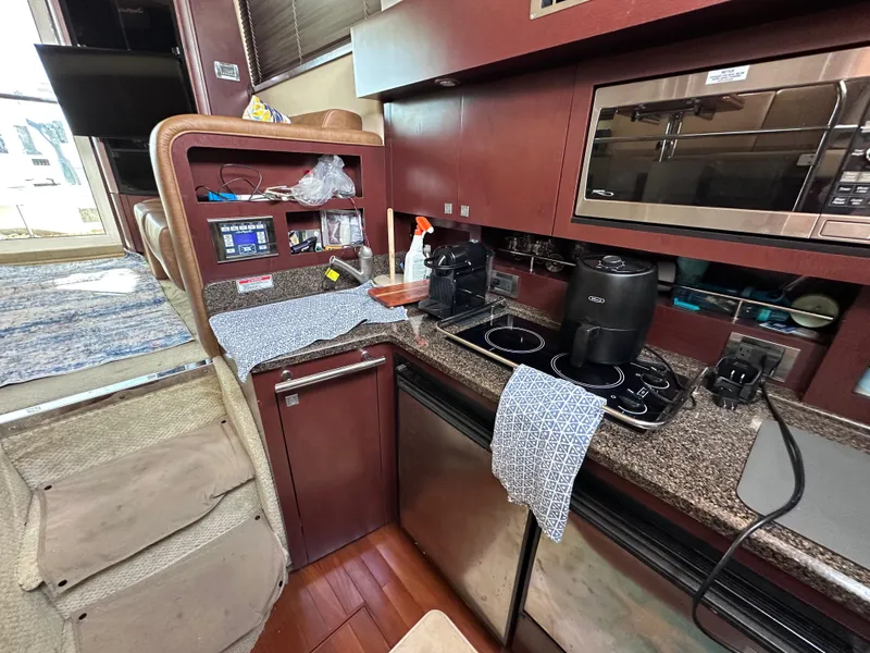 Slide: The Image of Interior of 2007 Sea Ray 36 Sedan Bridge with modern kitchen. - 23