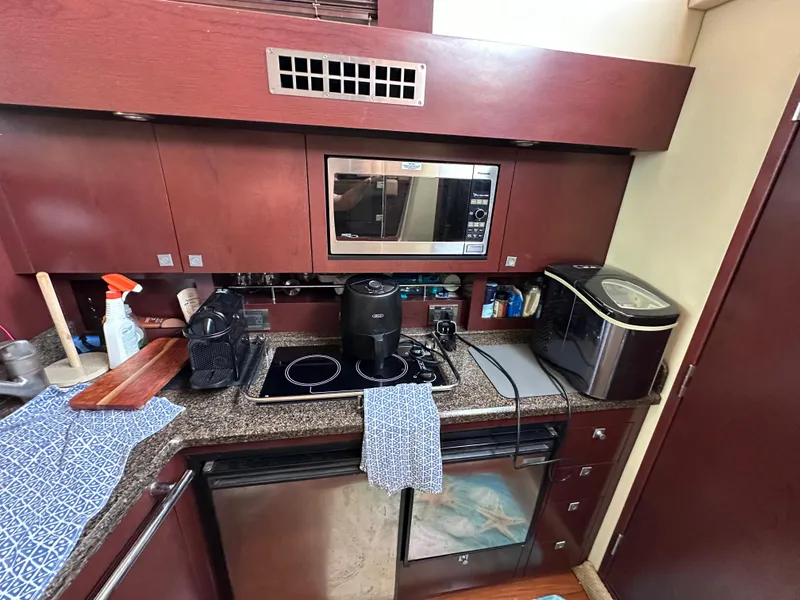 Slide: The Image of Kitchen area of 2007 Sea Ray 36 Sedan Bridge yacht. - 24