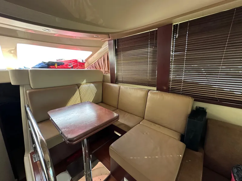 Slide: The Image of Interior of 2007 Sea Ray 36 Sedan Bridge with leather seating area. - 29