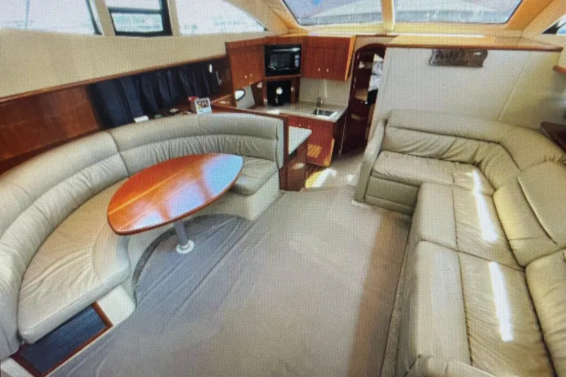 Slide: The Image of Luxurious interior of 2006 Cruisers Yachts 385 Motoryacht with leather seating and wood accents. - 12