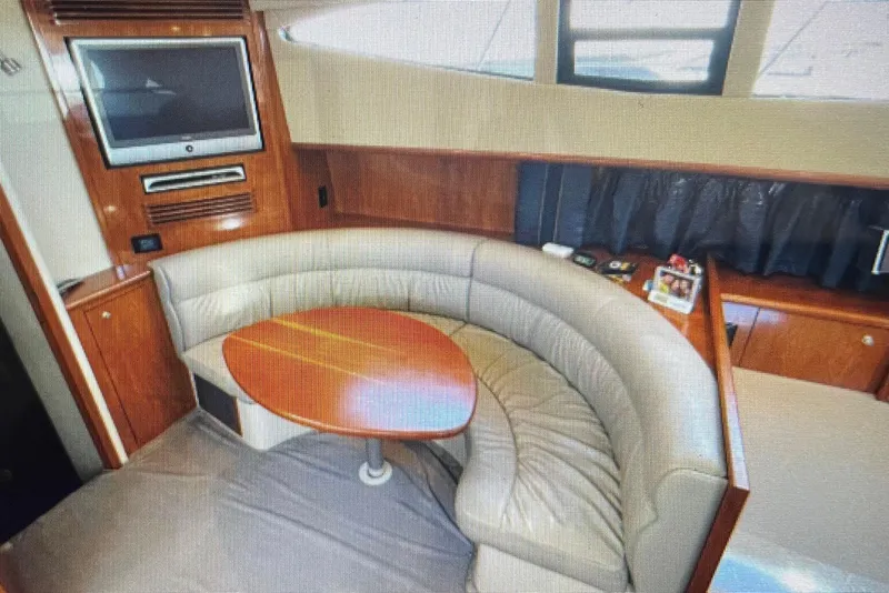 Slide: The Image of Luxurious interior of 2006 Cruisers Yachts 385 Motoryacht with curved seating and TV. - 13