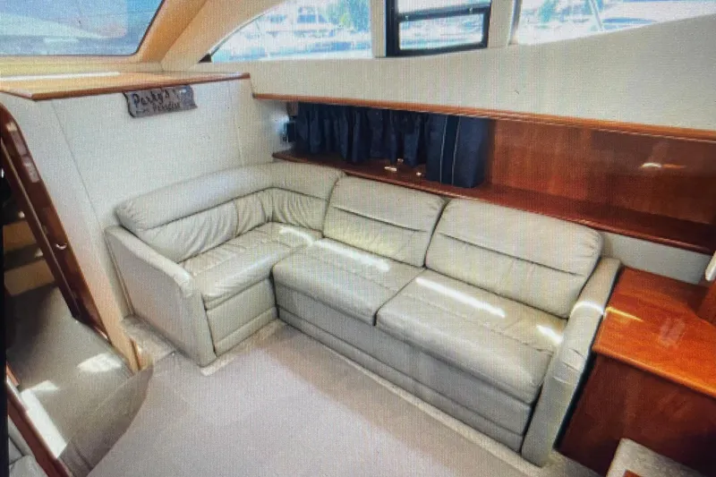 Slide: The Image of Luxurious interior of 2006 Cruisers Yachts 385 Motoryacht with leather seating and wood accents. - 14