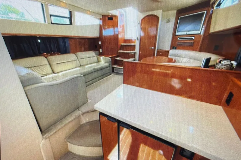 Slide: The Image of Luxurious interior of 2006 Cruisers Yachts 385 Motoryacht with elegant seating and wood finishes. - 15