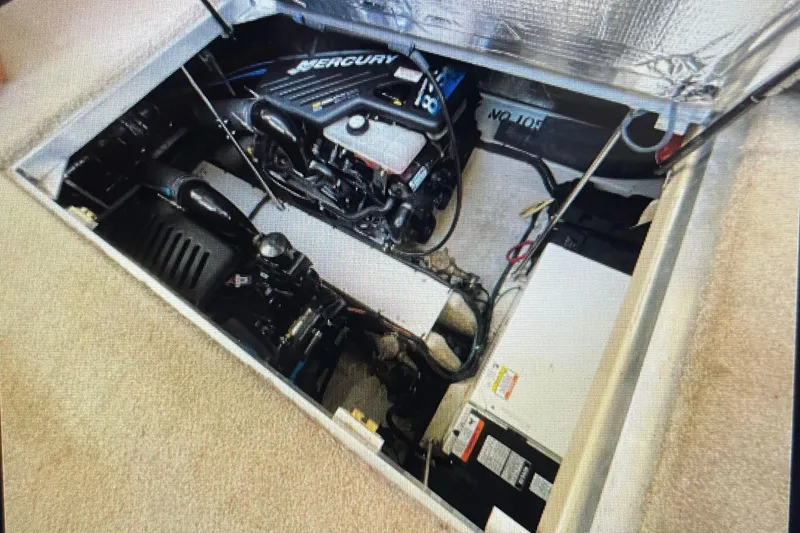 Slide: The Image of Engine compartment of 2006 Cruisers Yachts 385 Motoryacht with Mercury engine visible. - 22