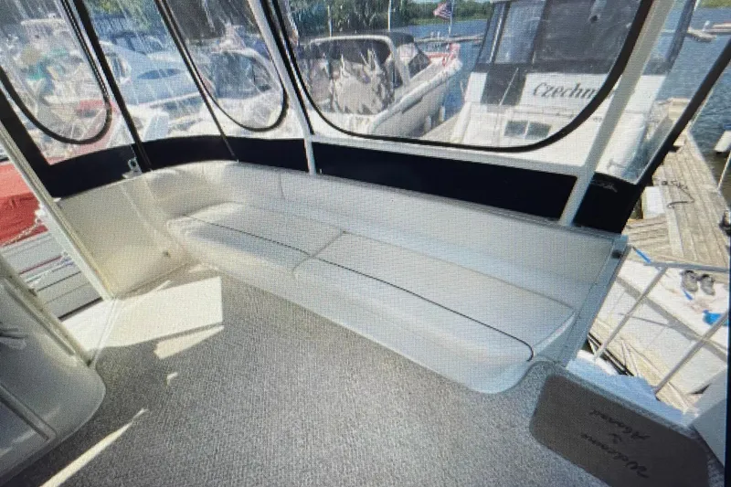 Slide: The Image of 2006 Cruisers Yachts 385 Motoryacht interior with cushioned seating and panoramic windows. - 6