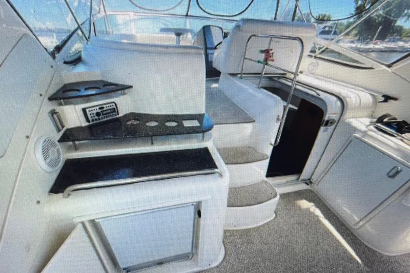 Slide: The Image of 2006 Cruisers Yachts 385 Motoryacht interior with steps, seating, and control panel. - 7