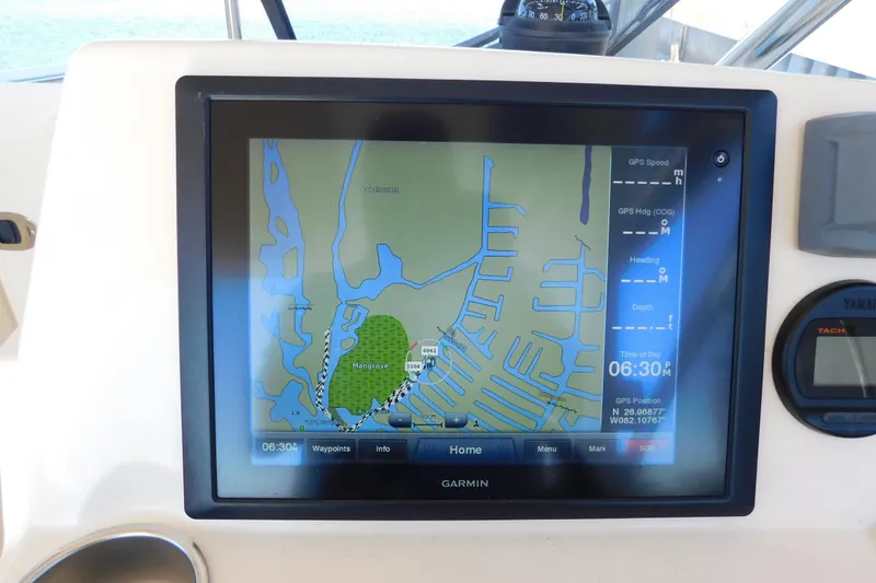 Slide: The Image of Garmin GPS display on 2015 Scout 275 Dorado boat, showing navigation map and data. - 17