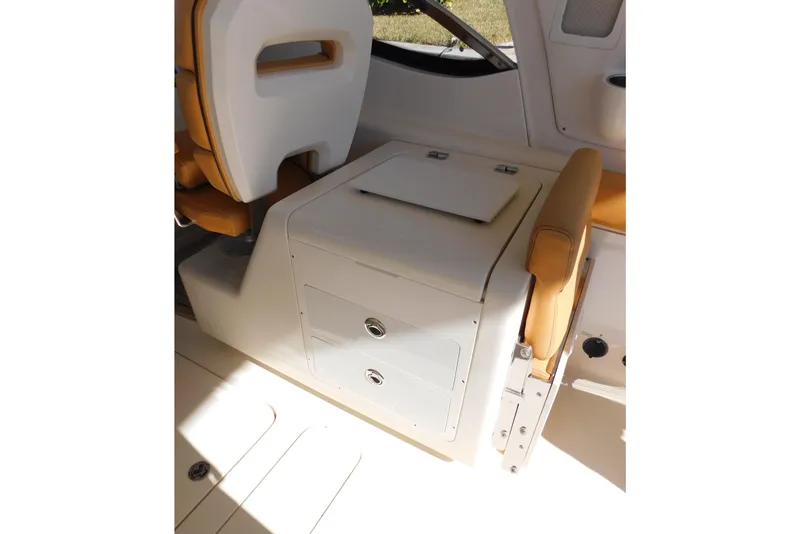 Slide: The Image of Interior of 2015 Scout 275 Dorado boat with seating and storage compartments. - 20