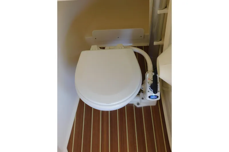 Slide: The Image of Boat toilet in 2015 Scout 275 Dorado, featuring Jabsco marine pump. - 25