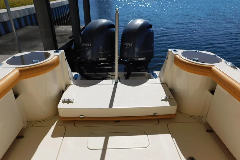 Slide: The Image of 2015 Scout 275 Dorado boat with twin outboard engines on a sunny day. - 26