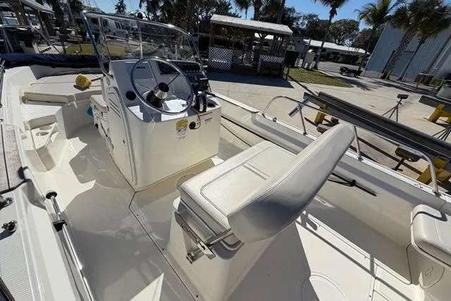 Slide: The Image of 2018 Boston Whaler 170 Montauk boat interior with steering console and seating. - 16