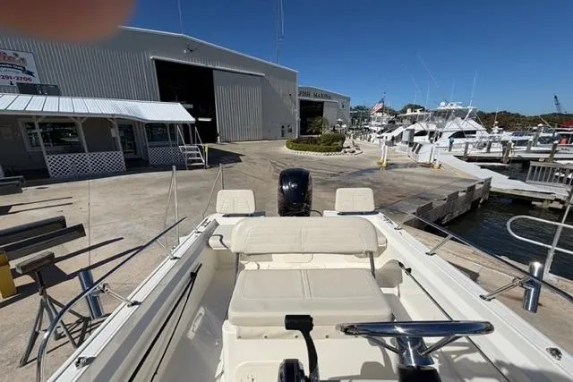 Slide: The Image of 2018 Boston Whaler 170 Montauk boat docked at marina with clear blue sky. - 19