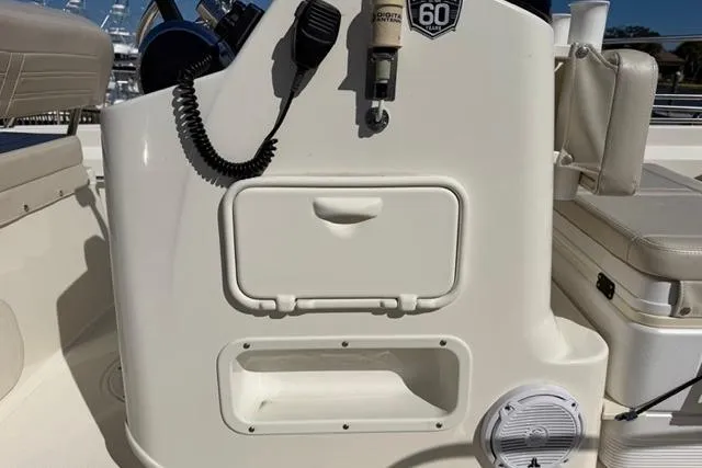 Slide: The Image of 2018 Boston Whaler 170 Montauk console with storage and marine equipment. - 24