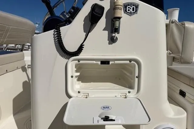Slide: The Image of 2018 Boston Whaler 170 Montauk console with storage compartment and communication equipment. - 25