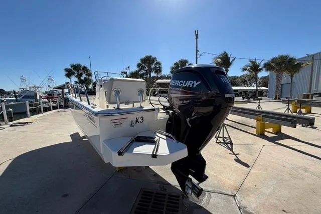 Slide: The Image of 2018 Boston Whaler 170 Montauk boat with Mercury engine at a marina. - 5