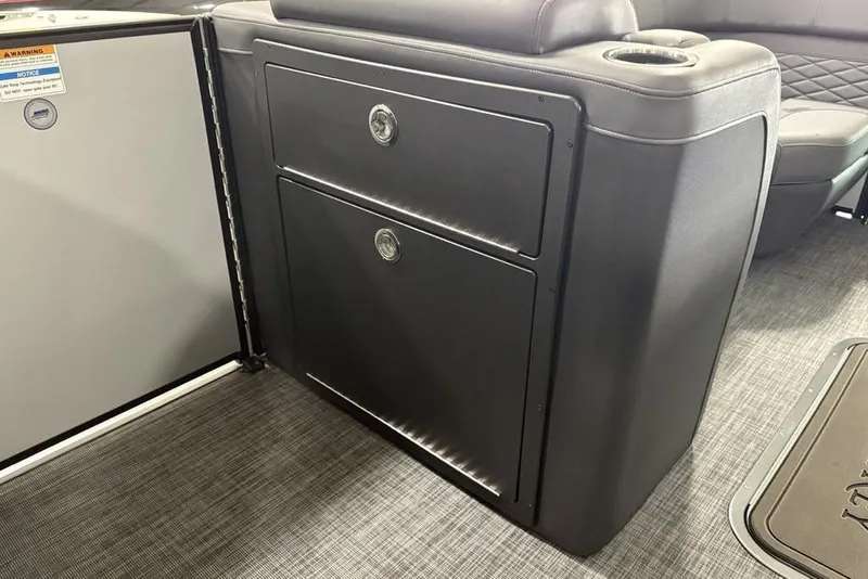 Slide: The Image of Interior of 2026 Godfrey Monaco 235 SB iMPACT, featuring sleek storage compartments. - 13