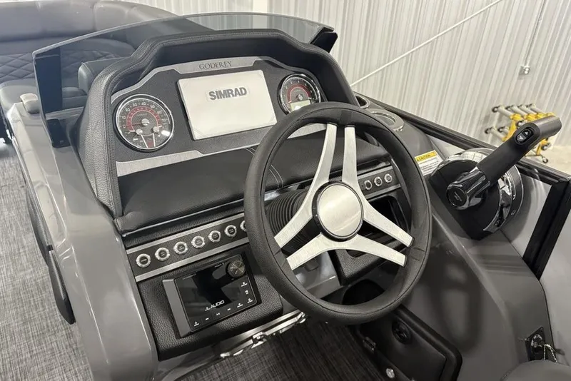Slide: The Image of Steering console of 2026 Godfrey Monaco 235 SB iMPACT Package with Simrad display. - 16
