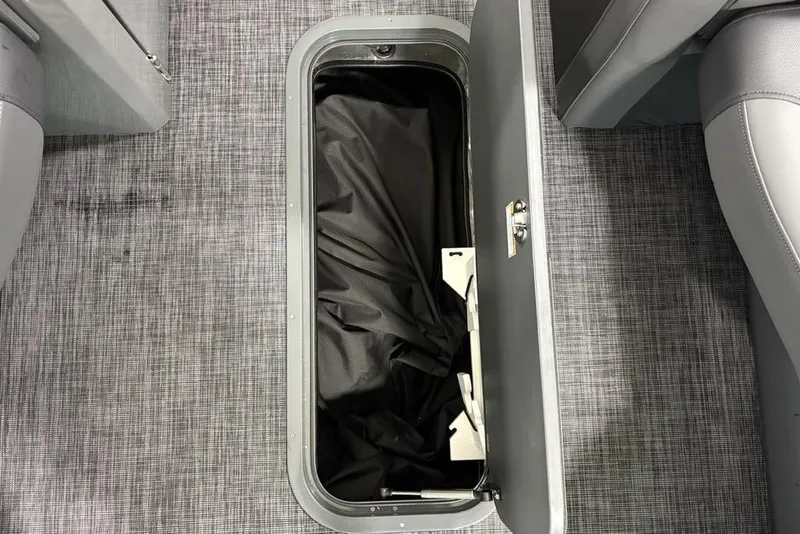 Slide: The Image of Open storage compartment in 2026 Godfrey Monaco 235 SB iMPACT pontoon boat. - 17