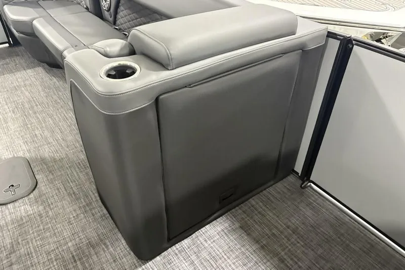 Slide: The Image of 2026 Godfrey Monaco 235 SB iMPACT boat interior with gray seating and cup holder. - 20