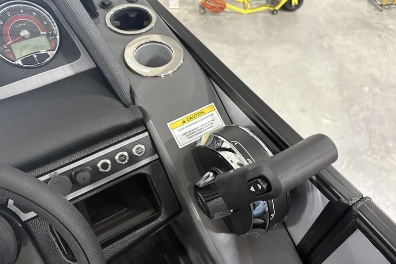 Slide: The Image of Control panel of 2026 Godfrey Monaco 235 SB iMPACT boat with throttle and gauges. - 21