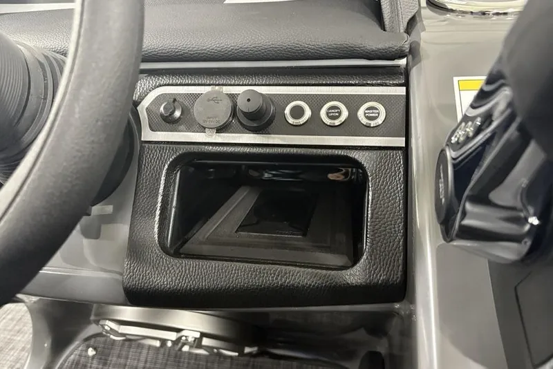 Slide: The Image of Control panel of 2026 Godfrey Monaco 235 SB iMPACT Package boat, featuring switches and storage. - 22