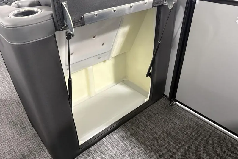 Slide: The Image of Storage compartment in 2026 Godfrey Monaco 235 SB iMPACT pontoon boat, open and empty. - 25