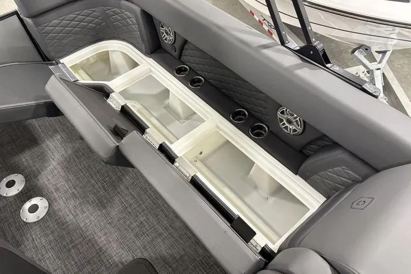Slide: The Image of Interior of 2026 Godfrey Monaco 235 SB with storage, speakers, and cup holders. - 27
