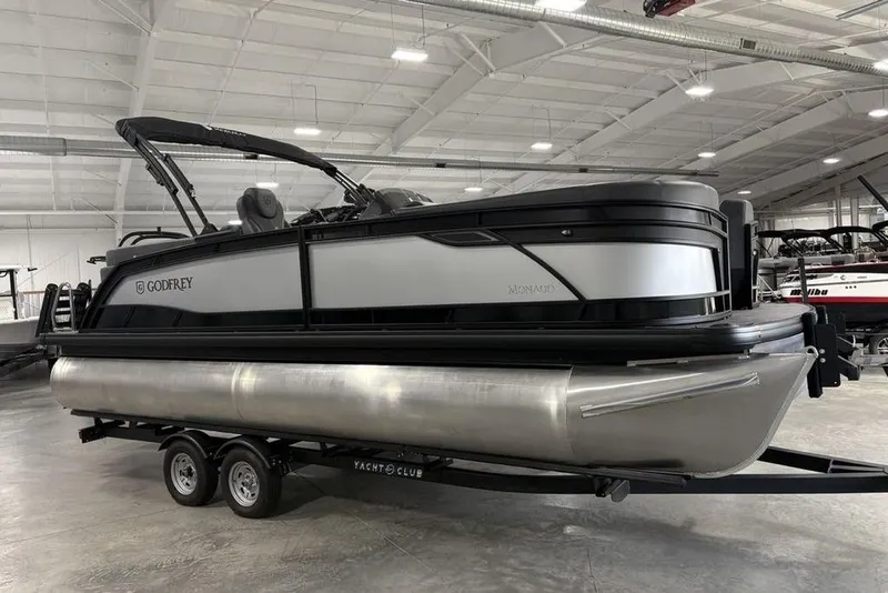 Slide: The Image of 2026 Godfrey Monaco 235 SB iMPACT pontoon boat in showroom, featuring sleek design and modern amenities. - 3