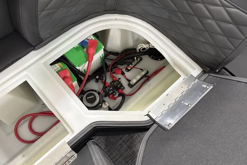 Slide: The Image of Storage compartment of 2026 Godfrey Monaco 235 SB iMPACT pontoon boat, showing battery and wiring. - 33
