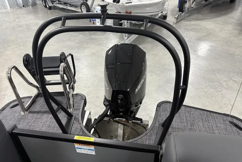 Slide: The Image of 2026 Godfrey Monaco 235 SB iMPACT boat with Mercury outboard motor in showroom. - 35