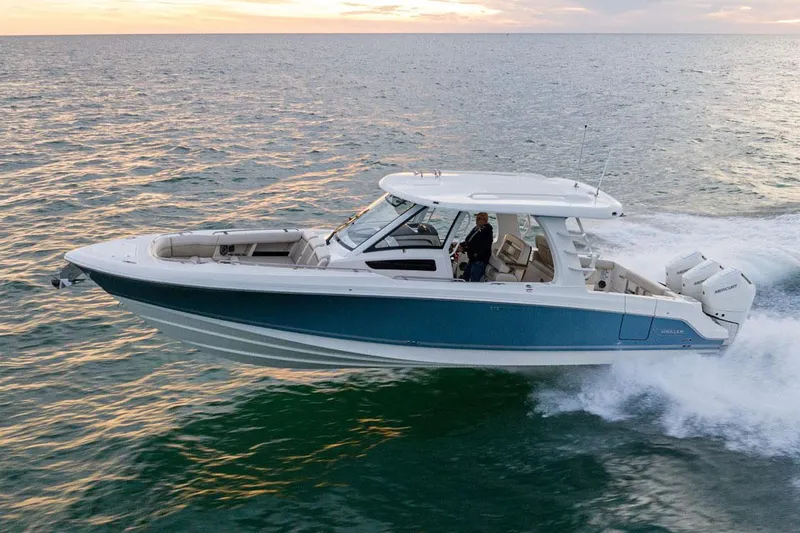 The Image of Manufacturer Provided Image: 2026 Boston Whaler 350 Realm cruising on open water at sunset. - 0