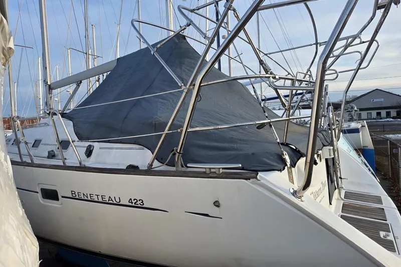 Slide: The Image of Beneteau Oceanis Clipper 423 sailboat, 2003 model, docked with protective cover. - 14