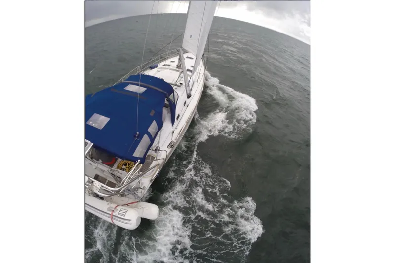 Slide: The Image of Sailing yacht Beneteau 423 (2003) navigating through choppy waters. - 23