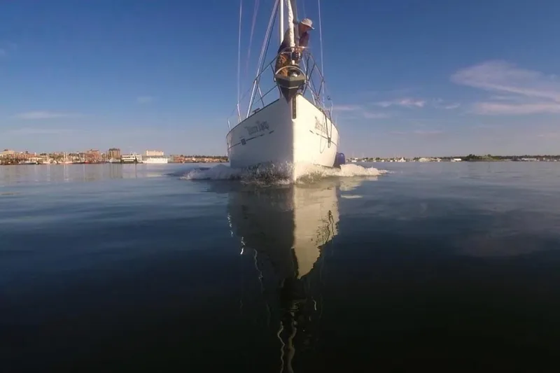 Slide: The Image of Sailing yacht Beneteau 423 (2003) cruising on calm waters under a clear blue sky. - 30