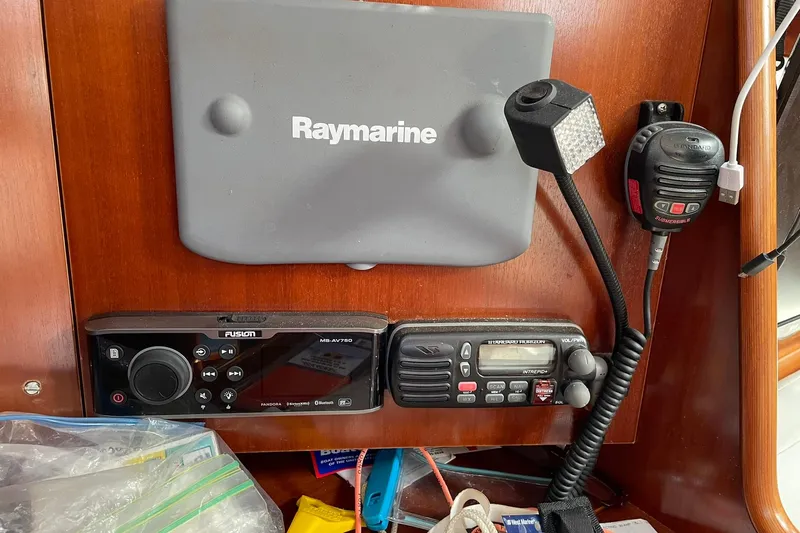 Slide: The Image of Control panel of a 2003 Beneteau 423 yacht with Raymarine and Fusion equipment. - 34