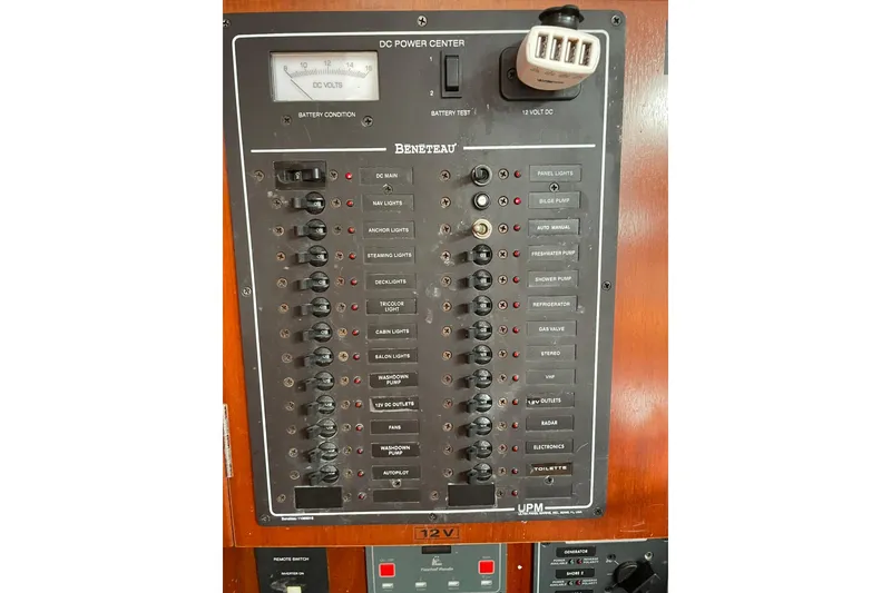 Slide: The Image of Electrical panel of a 2003 Beneteau 423 sailboat, featuring various switches and controls. - 41