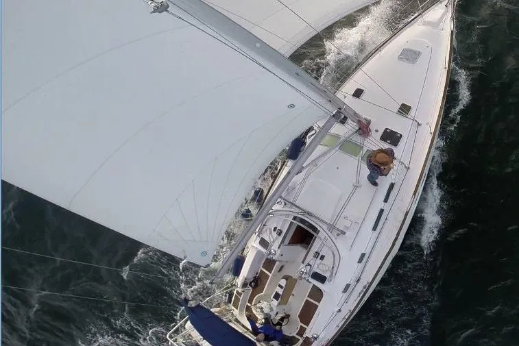 Slide: The Image of Aerial view of 2003 Beneteau Oceanis Clipper 423 sailing on open water. - 10