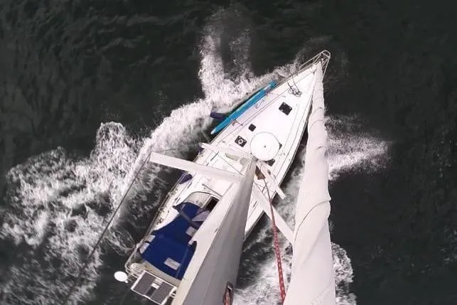Slide: The Image of Aerial view of 2003 Beneteau Oceanis Clipper 423 sailing on open water. - 6